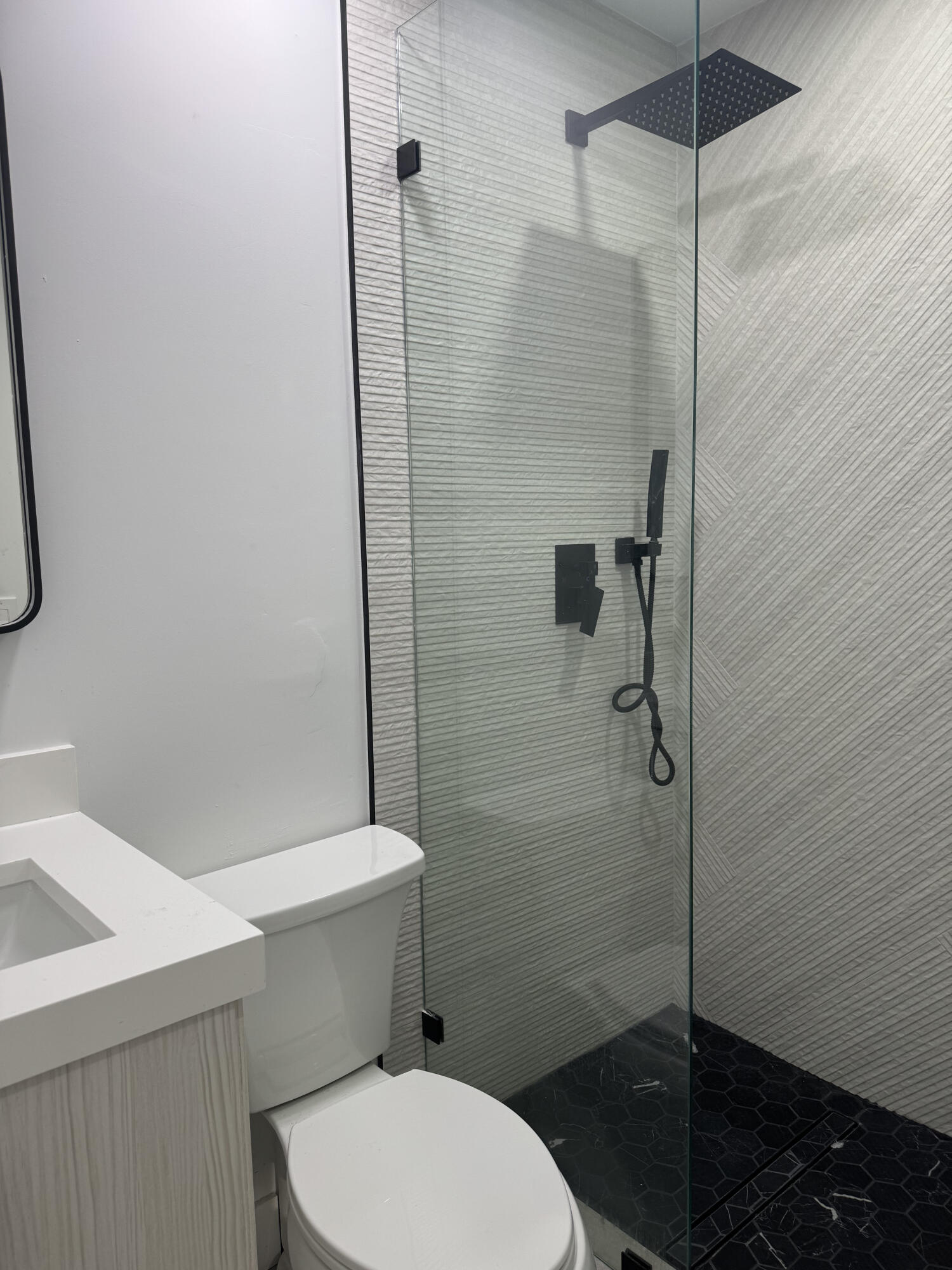 1191 Southwest 15th Street Boca Raton, FL 33486 - Photo 5 of 6 a bathroom with a toilet and a shower