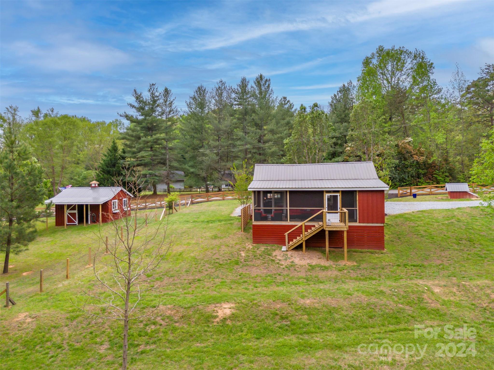 104 Red Barn Road Landrum, SC 29356 - Photo 28 of 36 an aerial view of a house with swimming pool garden and trees
