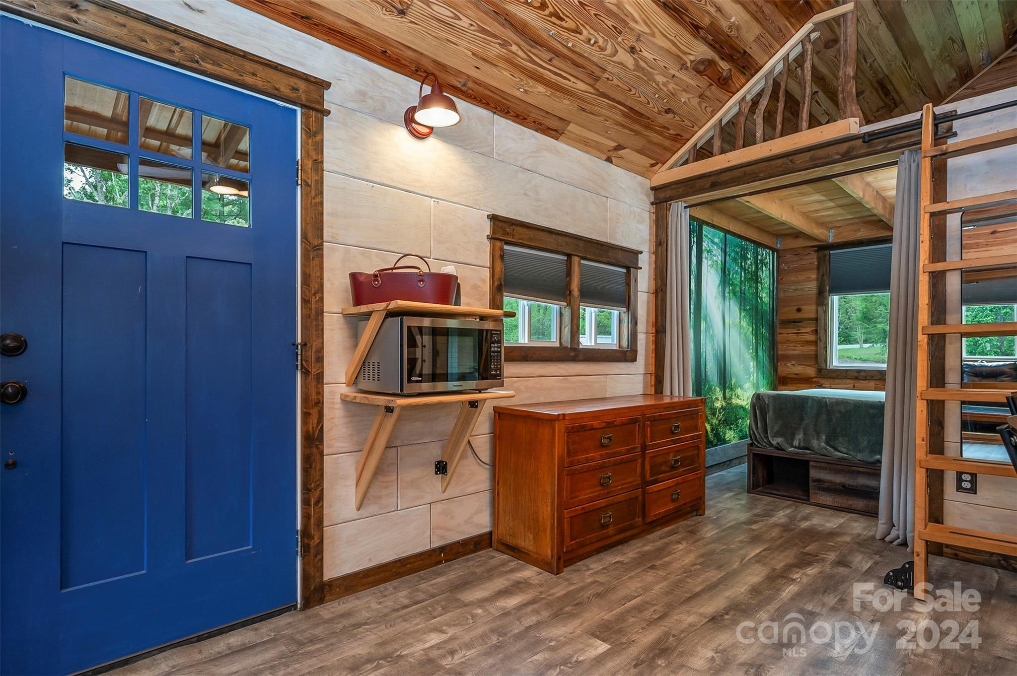 104 Red Barn Road Landrum, SC 29356 - Photo 7 of 36 a room with a bed and a chair