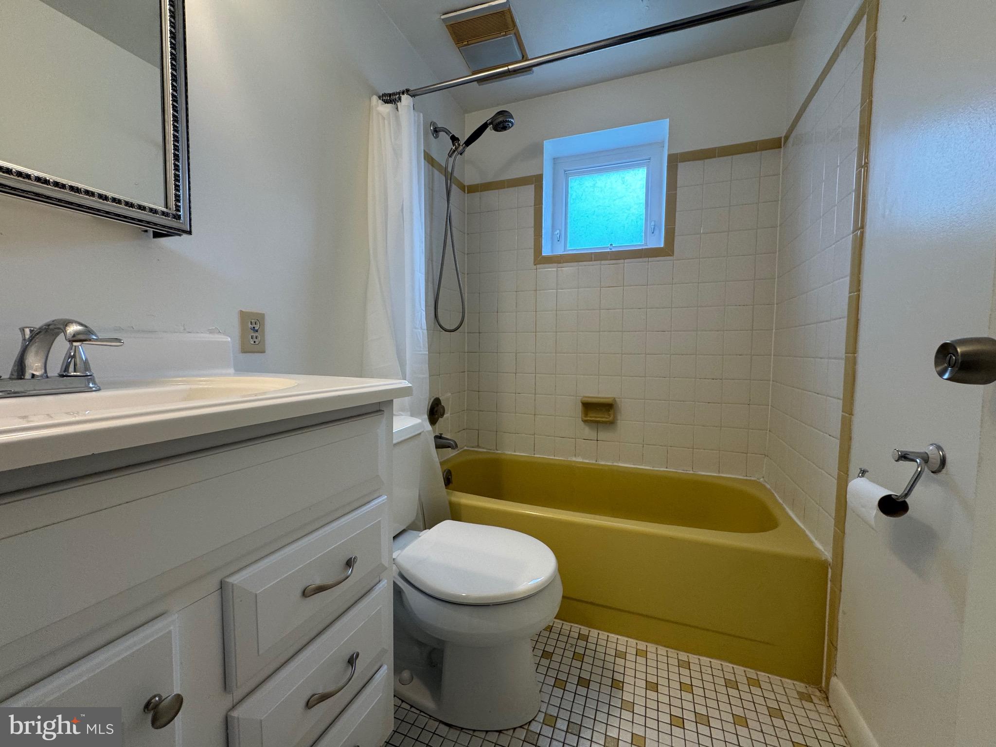 212 11th Street Laurel, MD 20707 - Photo 20 of 39 a bathroom with a sink a toilet and a bathtub