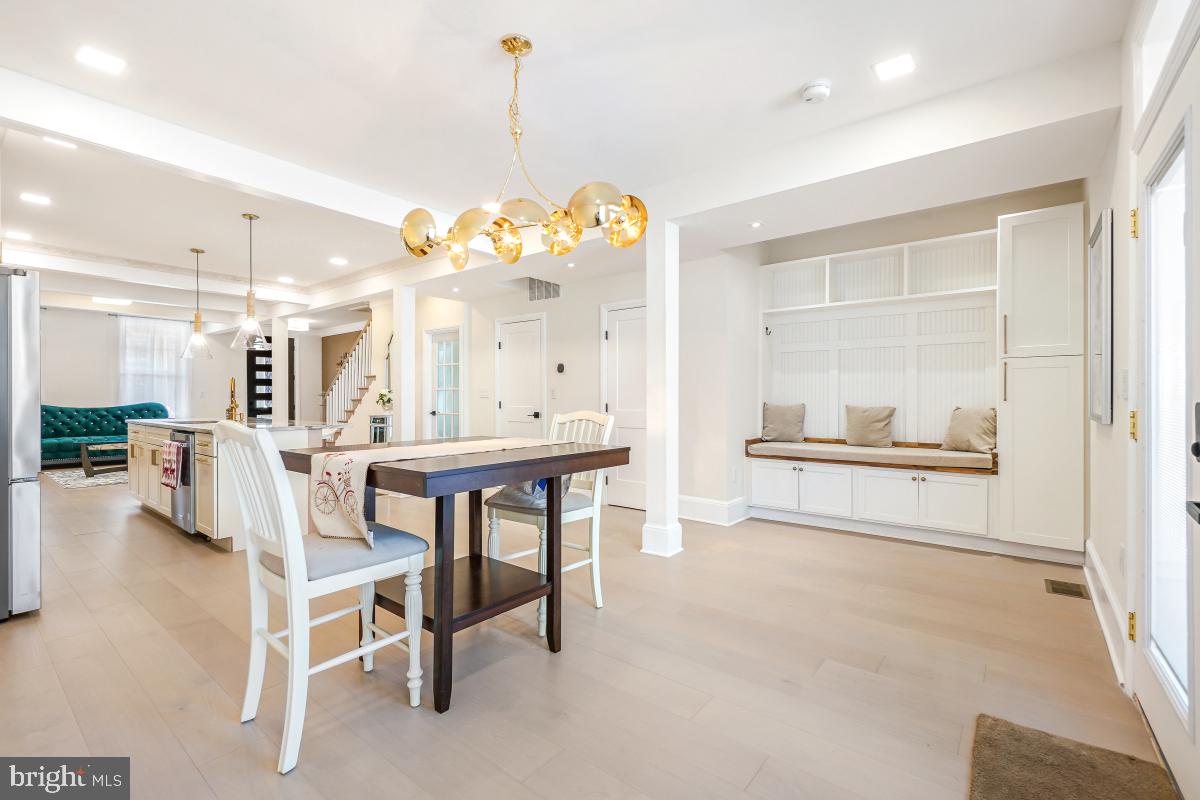 4420 15th Street Northwest Washington, DC 20011 - Photo 11 of 30 a view of a dining room with furniture and a chandelier