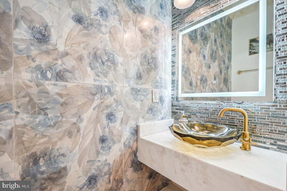 4420 15th Street Northwest Washington, DC 20011 - Photo 12 of 30 a bathroom with a sink and a mirror