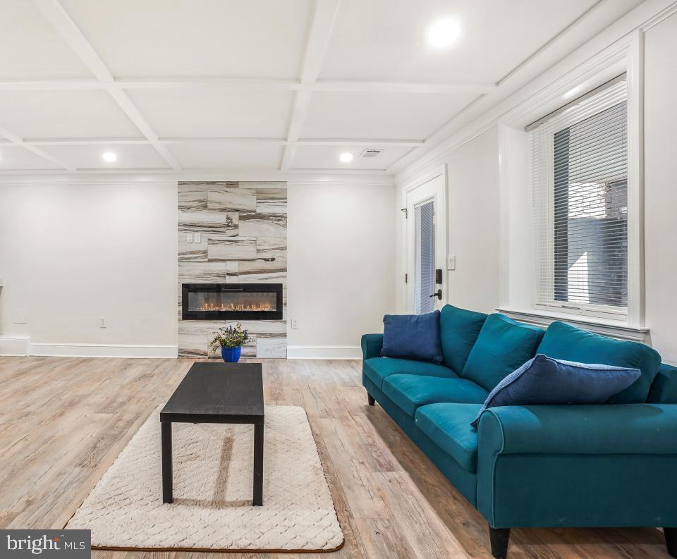 4420 15th Street Northwest Washington, DC 20011 - Photo 21 of 30 a living room with furniture and a flat screen tv