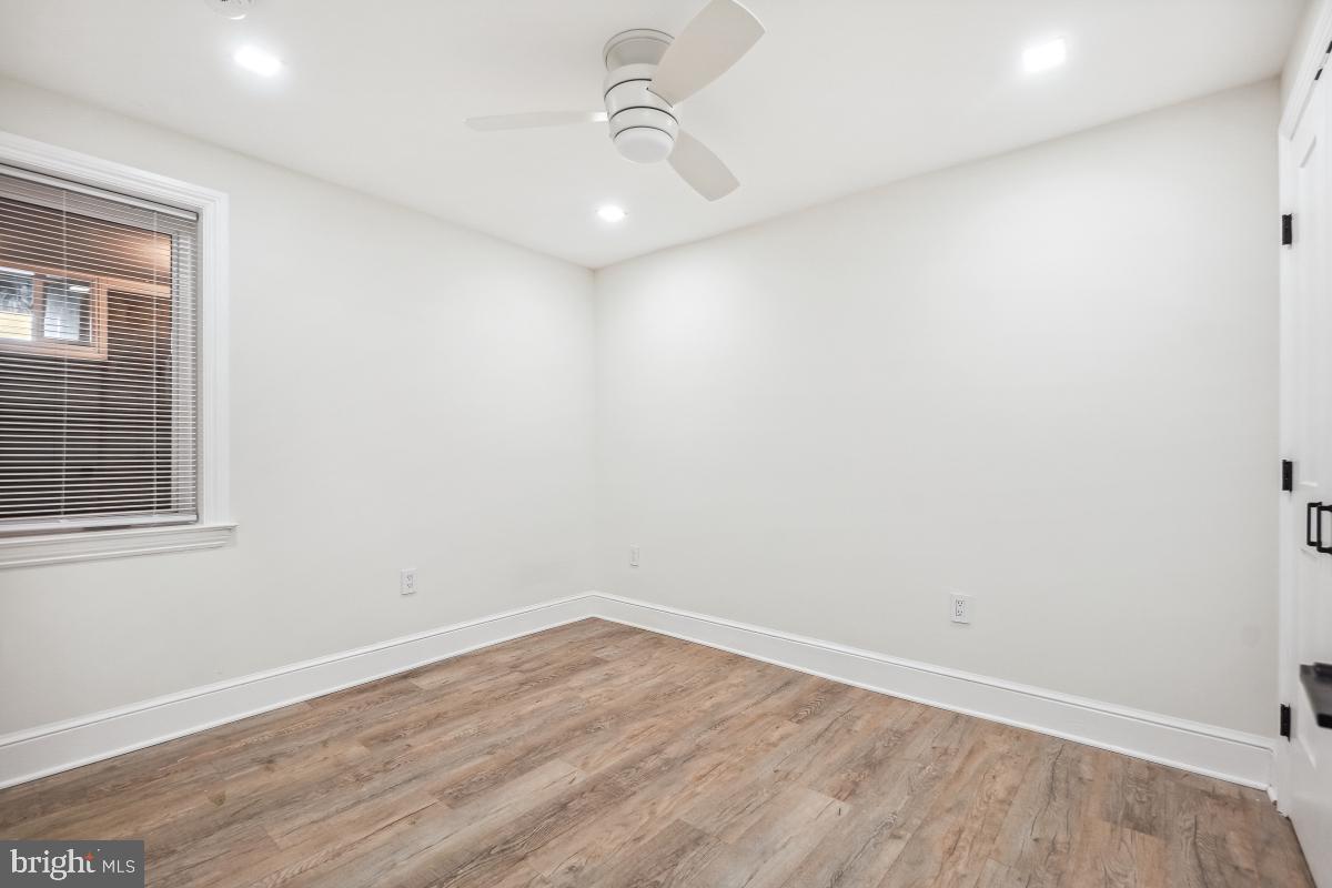 4420 15th Street Northwest Washington, DC 20011 - Photo 25 of 30 an empty room with wooden floor and windows