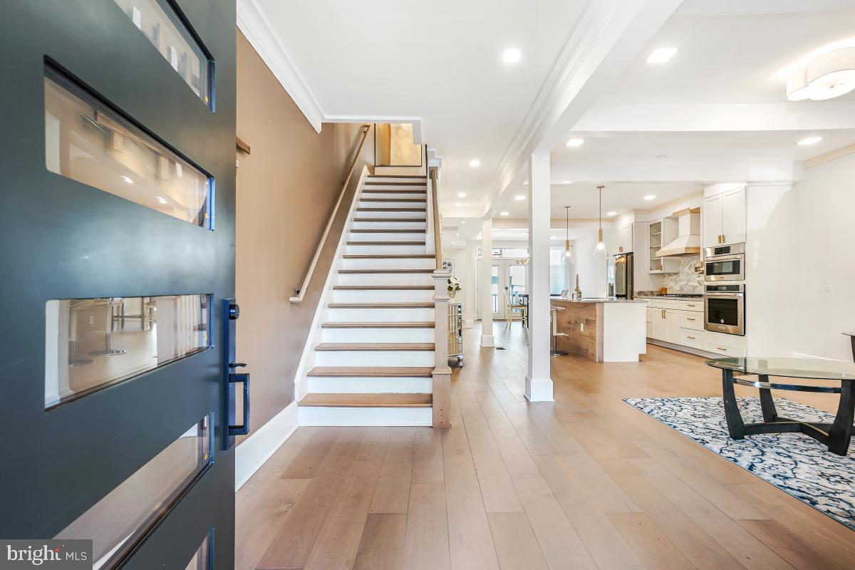 4420 15th Street Northwest Washington, DC 20011 - Photo 3 of 30 a view of a living room with wooden floor and furniture