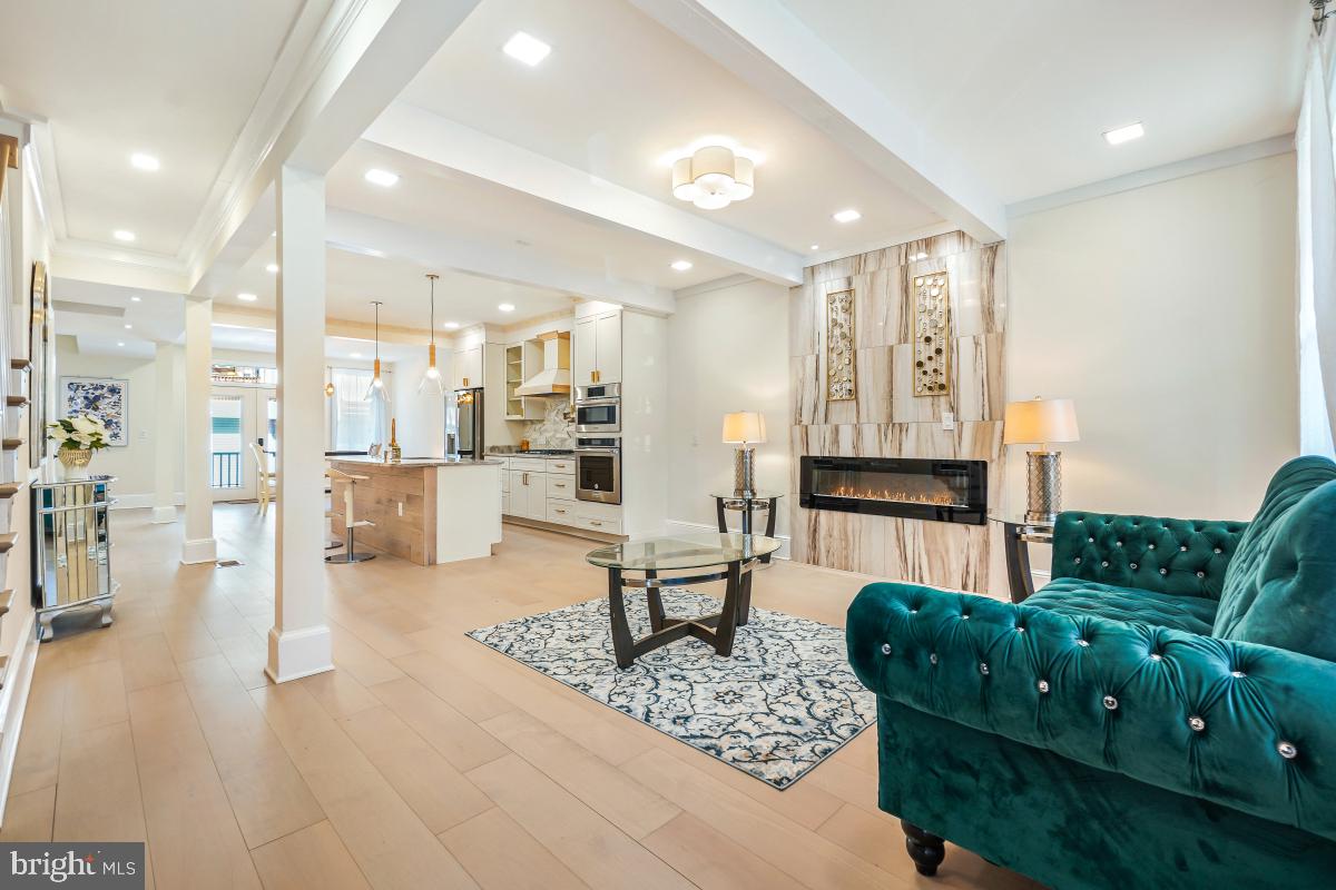 4420 15th Street Northwest Washington, DC 20011 - Photo 6 of 30 a living room with furniture and a dining table with kitchen view