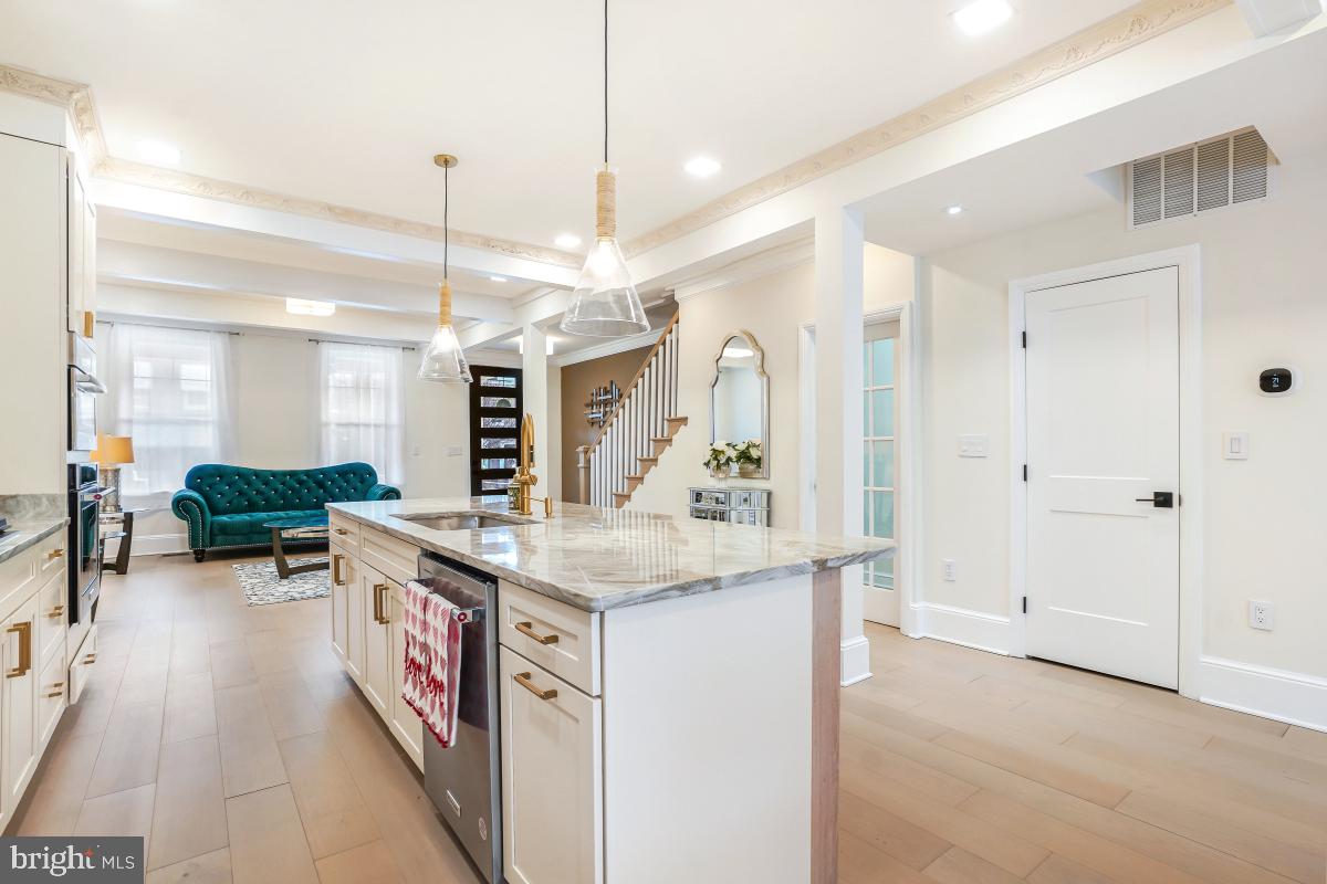 4420 15th Street Northwest Washington, DC 20011 - Photo 8 of 30 a kitchen with stainless steel appliances granite countertop a stove and a refrigerator