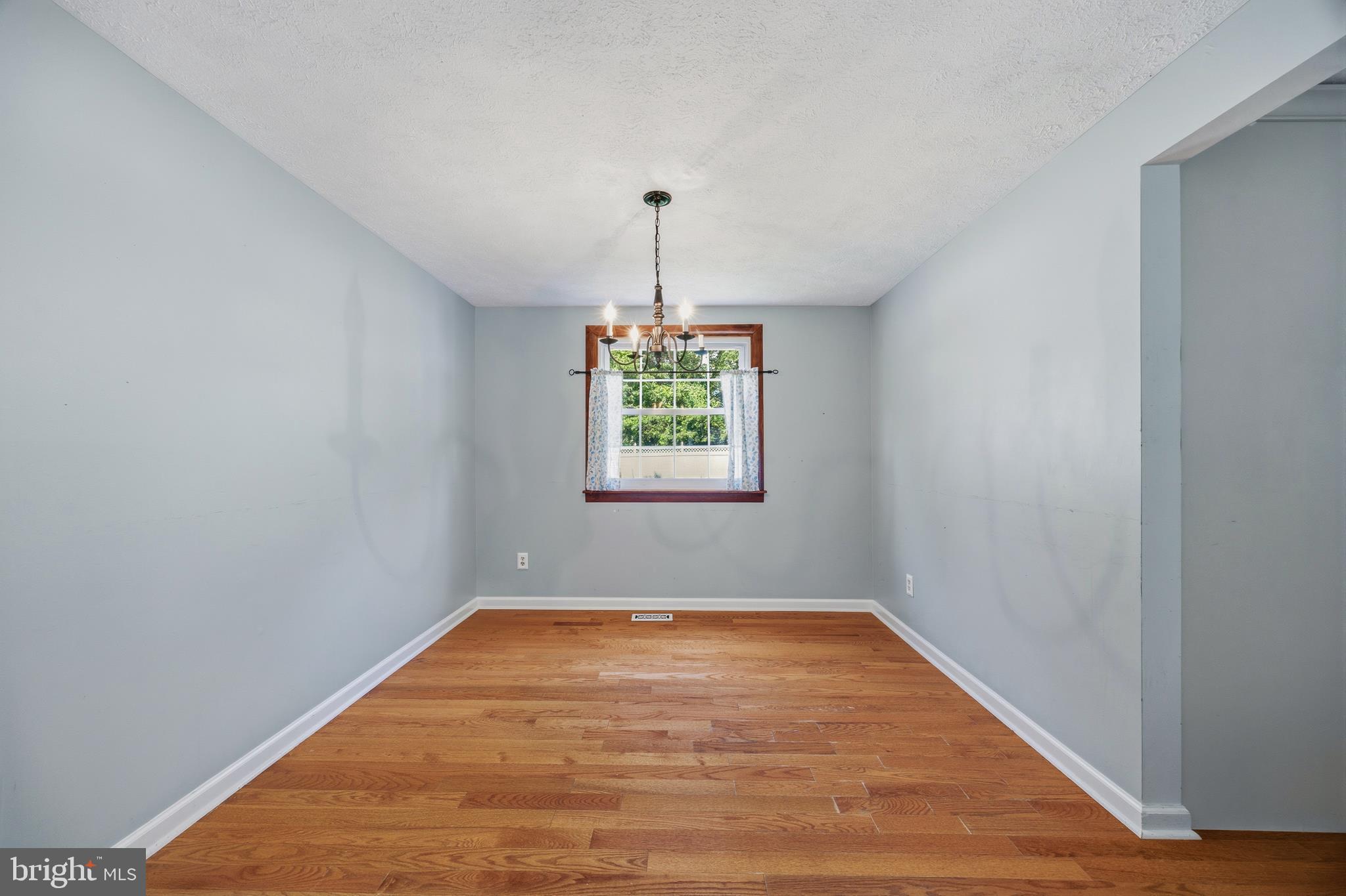 1506 Gollum Road Hanover, MD 21076 - Photo 9 of 44 a view of empty room with window and ceiling fan