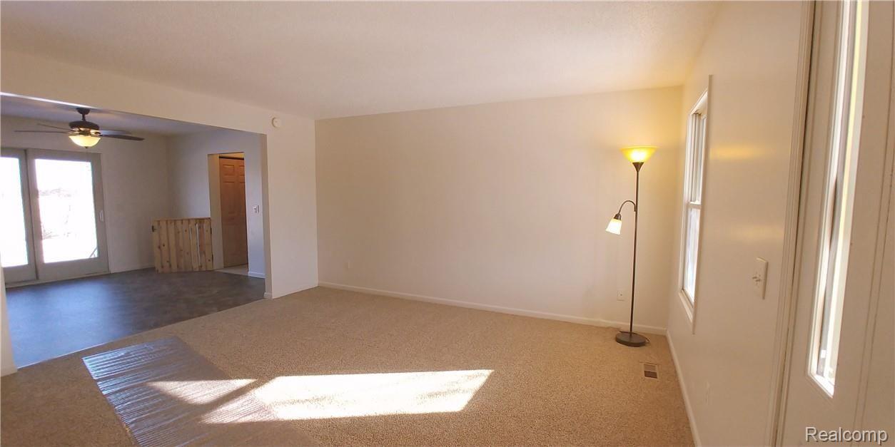 886 Chase Lake Road Howell, MI 48855 - Photo 5 of 52 2a. living room flows into kitchen/dining combo, nice for entertaining.