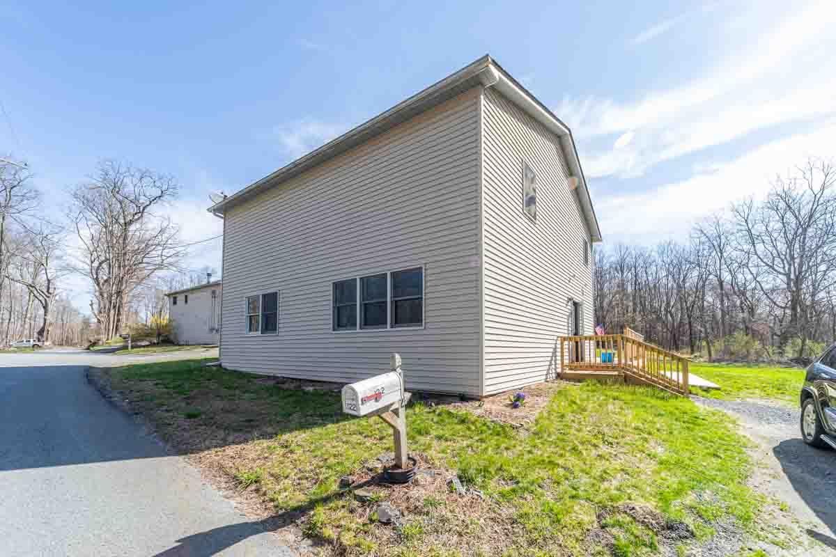 a front view of house with garden