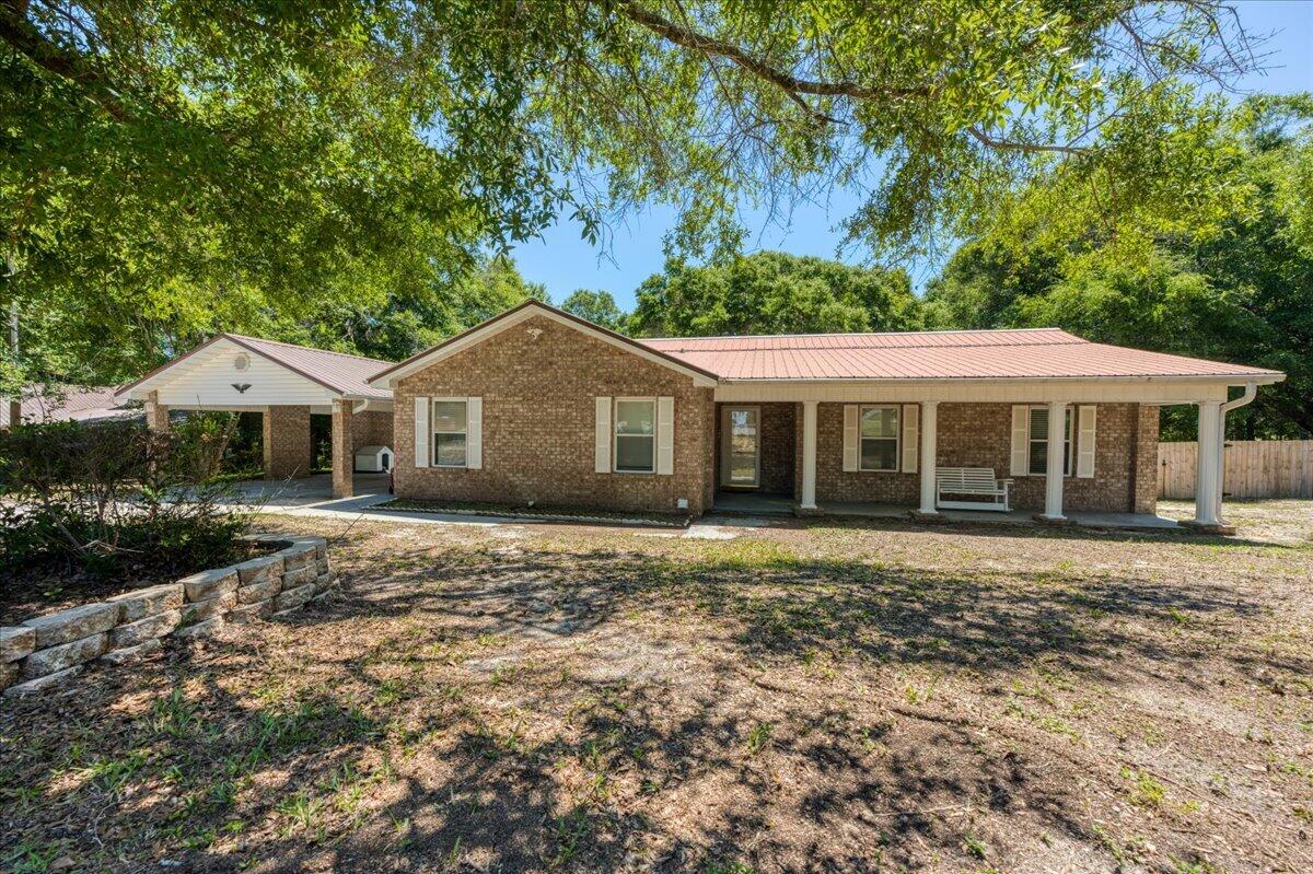 210 Shell Drive Crestview, FL 32536 - Photo 8 of 67 a front view of a house with a yard