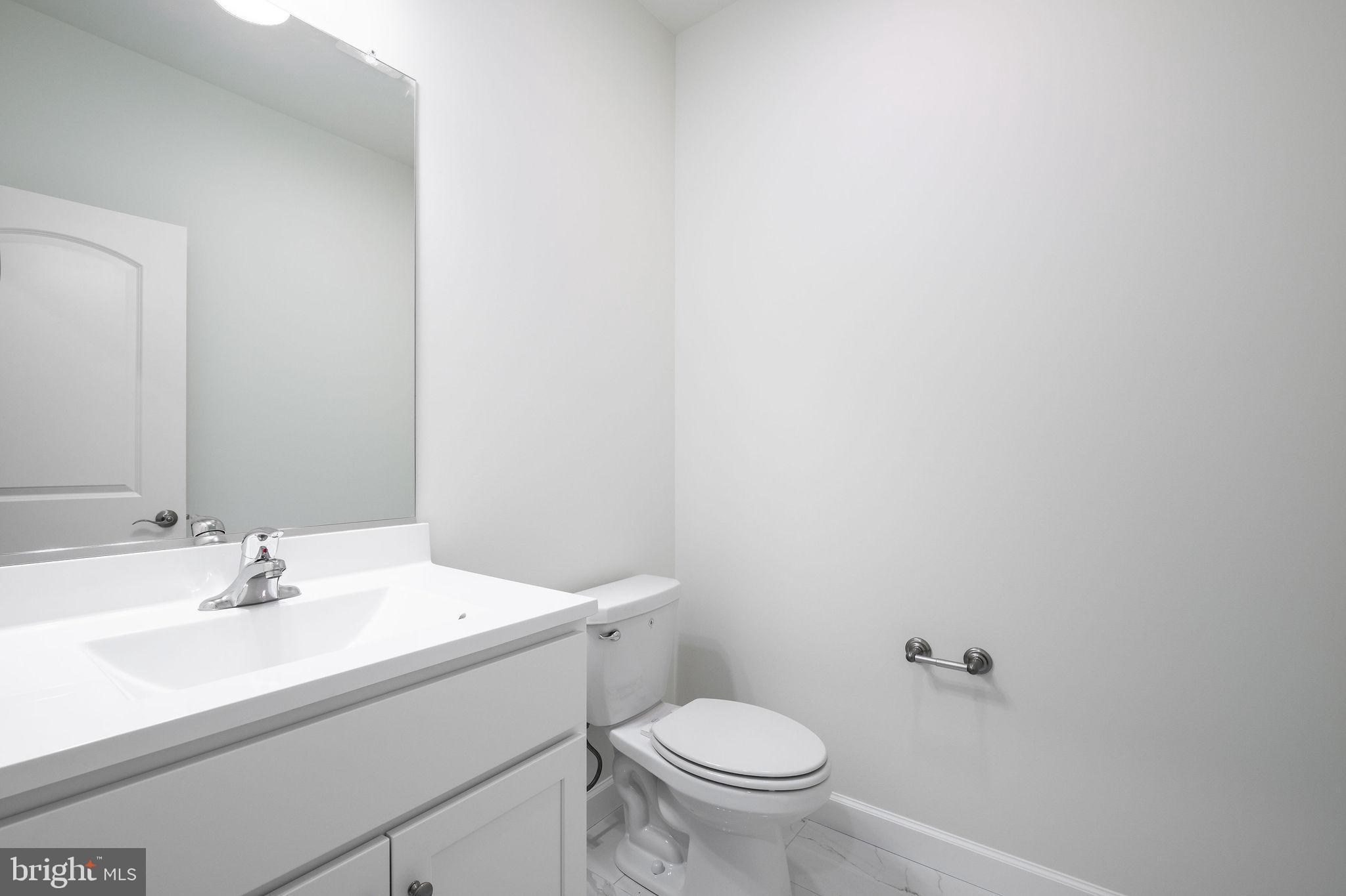 5 Valhalla Court Dover, DE 19904 - Photo 14 of 53 a bathroom with a sink toilet and a mirror