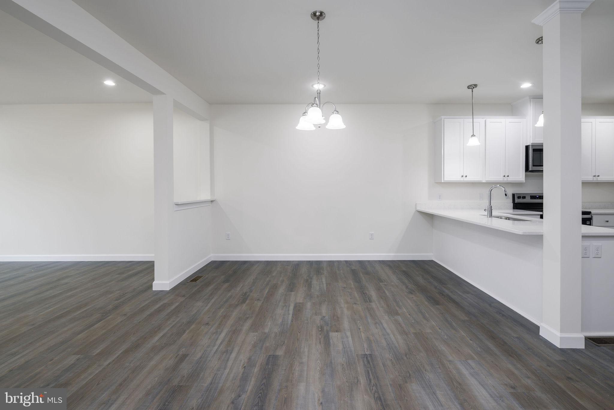 5 Valhalla Court Dover, DE 19904 - Photo 23 of 53 an empty room with wooden floor and windows