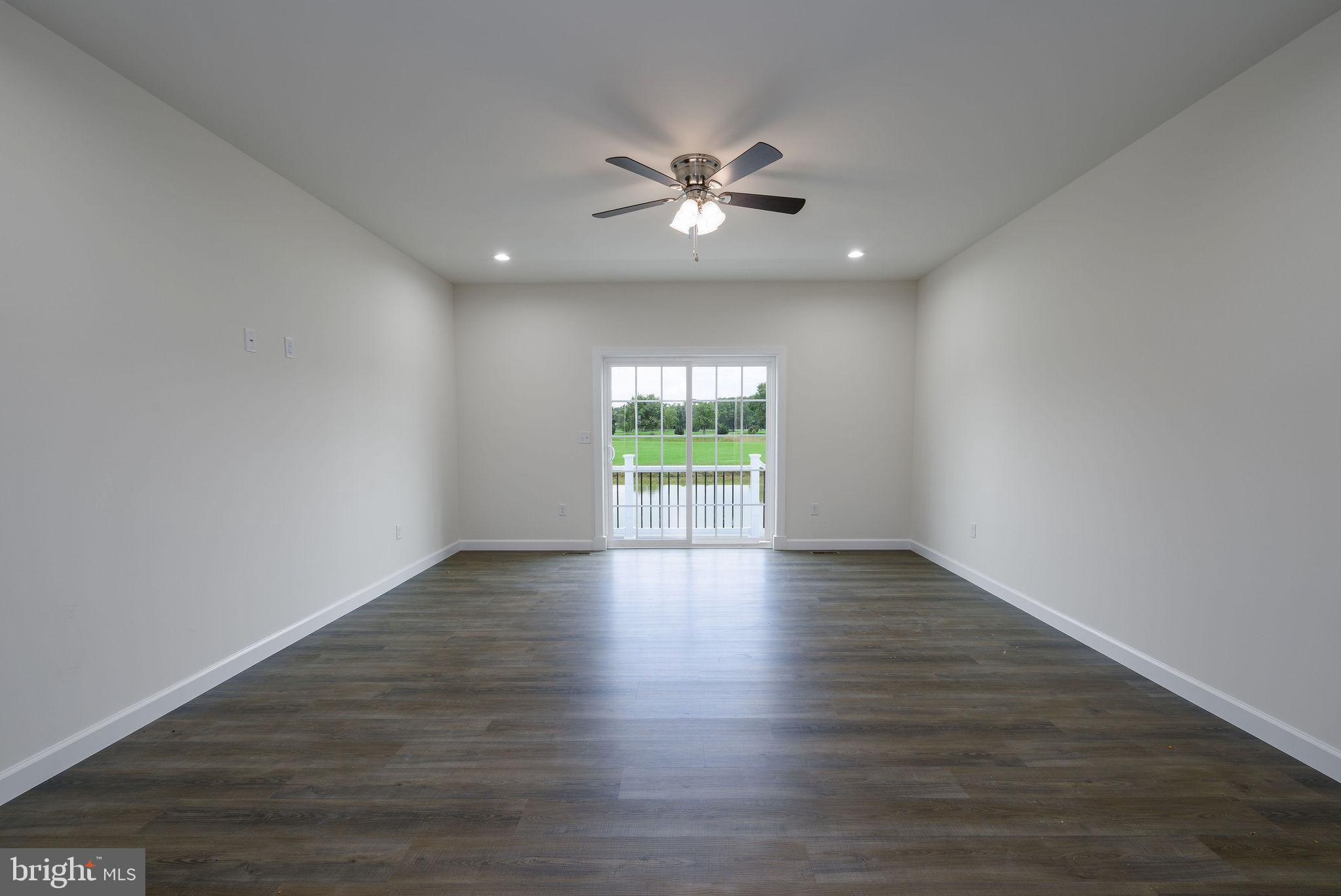 5 Valhalla Court Dover, DE 19904 - Photo 24 of 53 a view of an empty room with wooden floor and a window