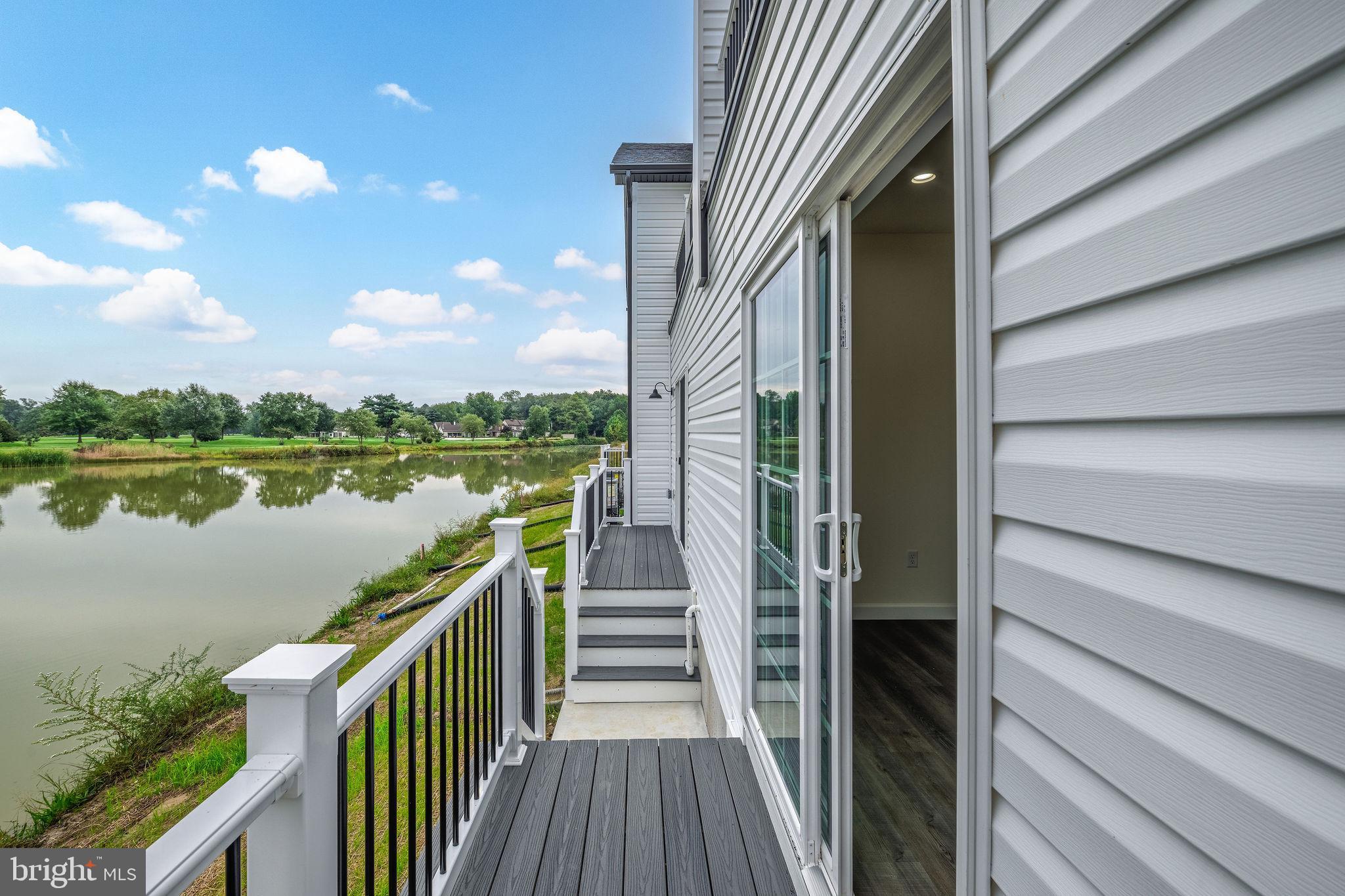 5 Valhalla Court Dover, DE 19904 - Photo 27 of 53 a view of a lake from a balcony