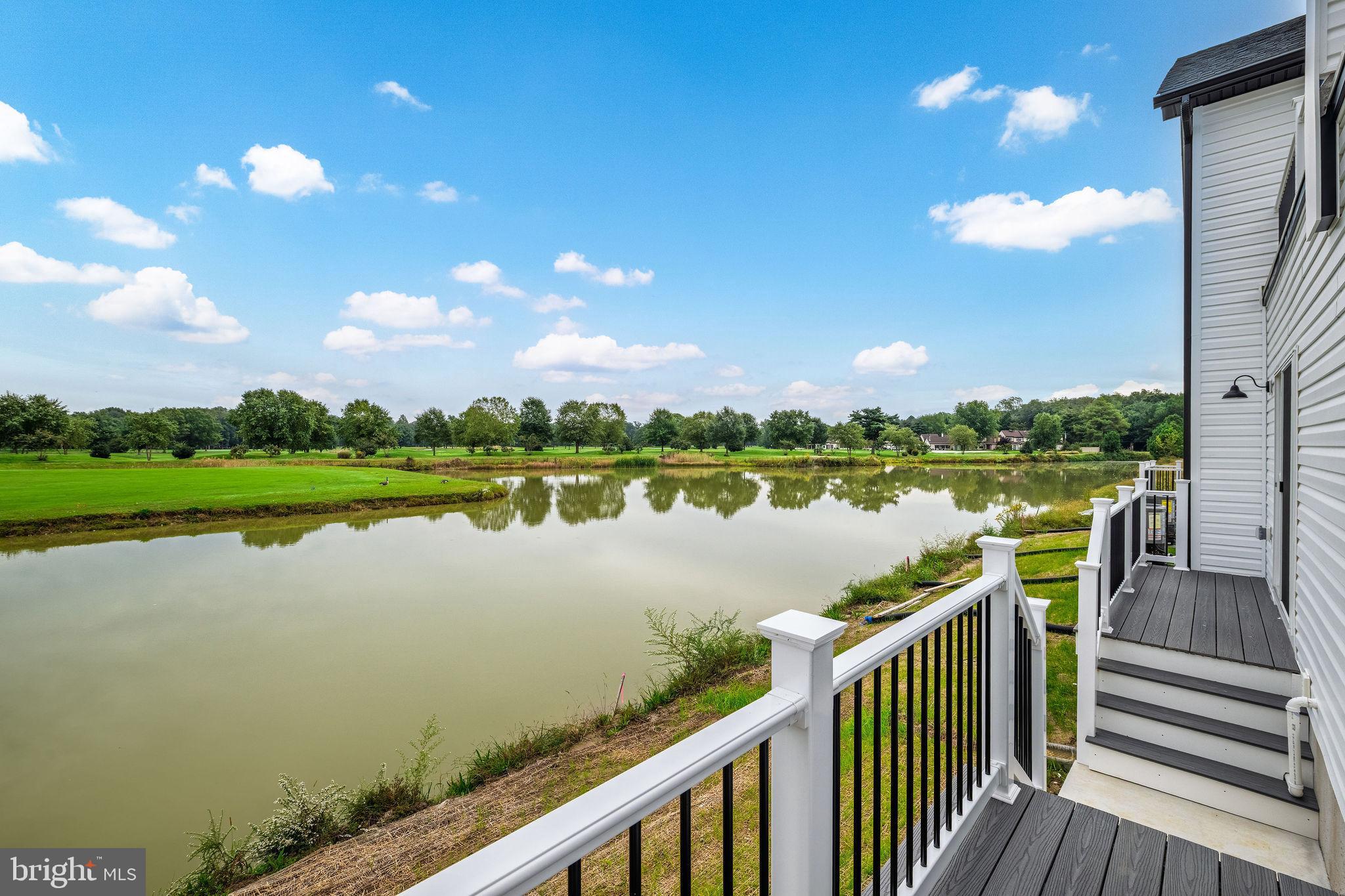 5 Valhalla Court Dover, DE 19904 - Photo 28 of 53 a view of a lake with houses in the back