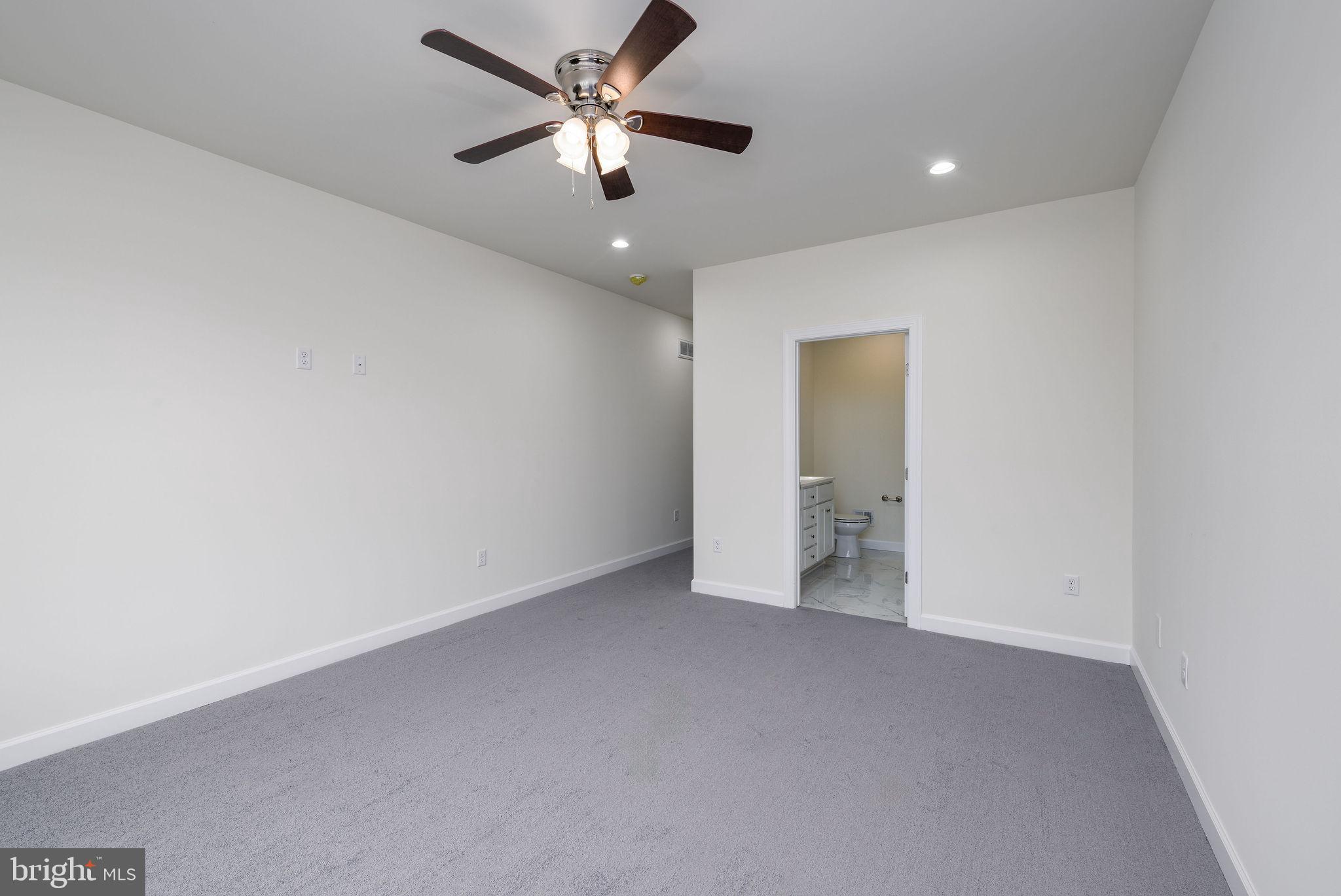 5 Valhalla Court Dover, DE 19904 - Photo 30 of 53 an empty room with a ceiling fan and a window