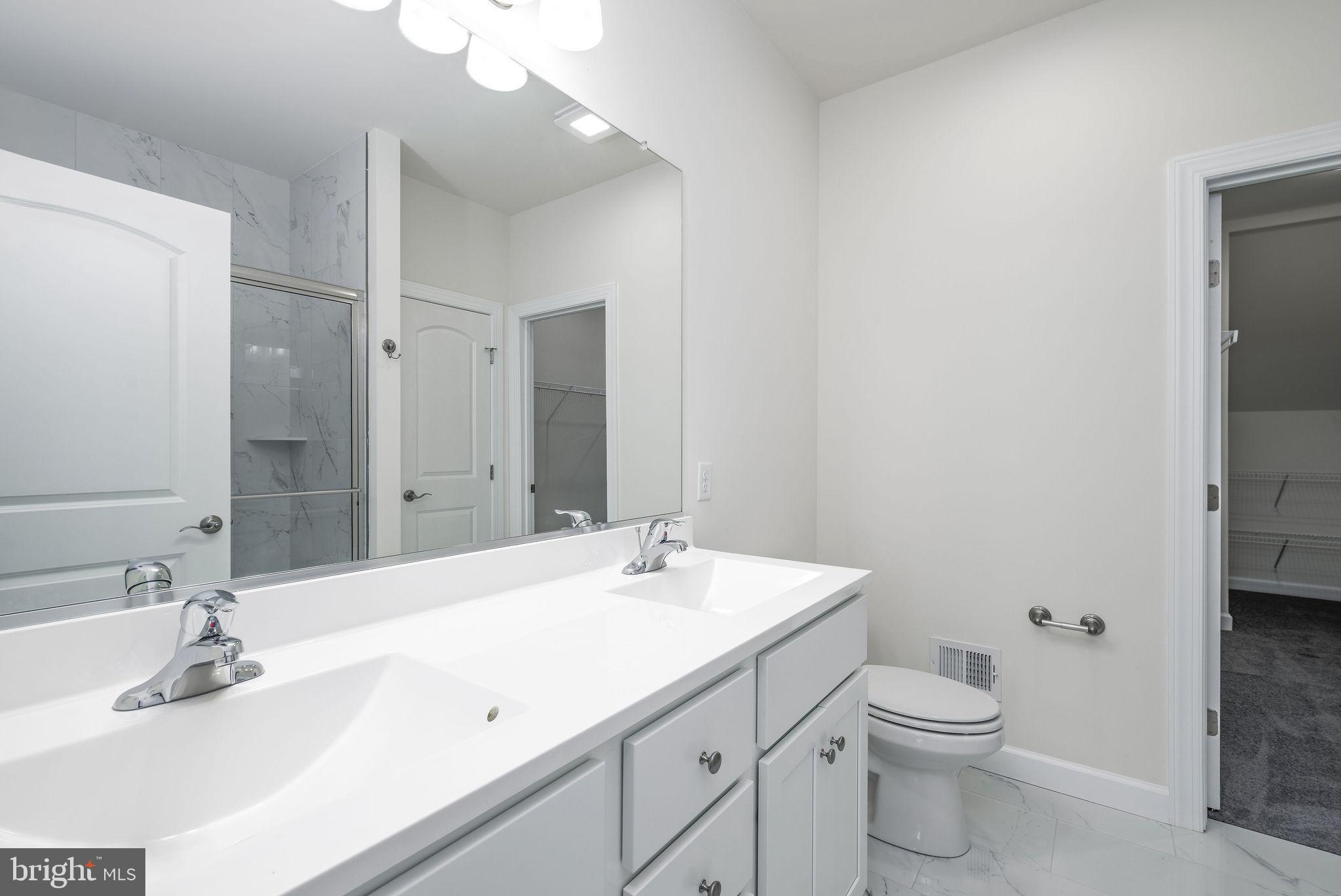 5 Valhalla Court Dover, DE 19904 - Photo 31 of 53 a bathroom with a sink a toilet and shower