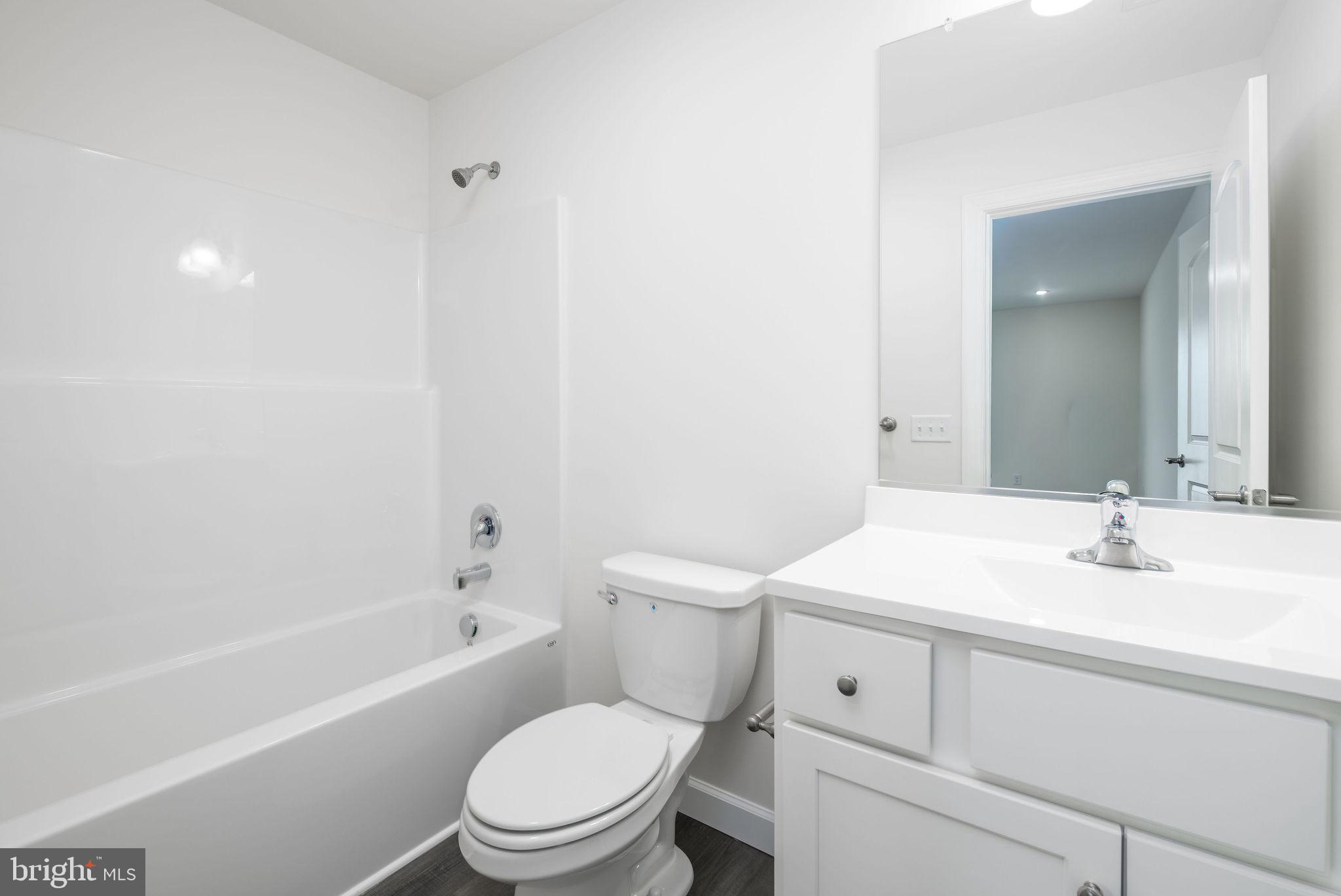 5 Valhalla Court Dover, DE 19904 - Photo 44 of 53 a bathroom with a sink a toilet and bathtub