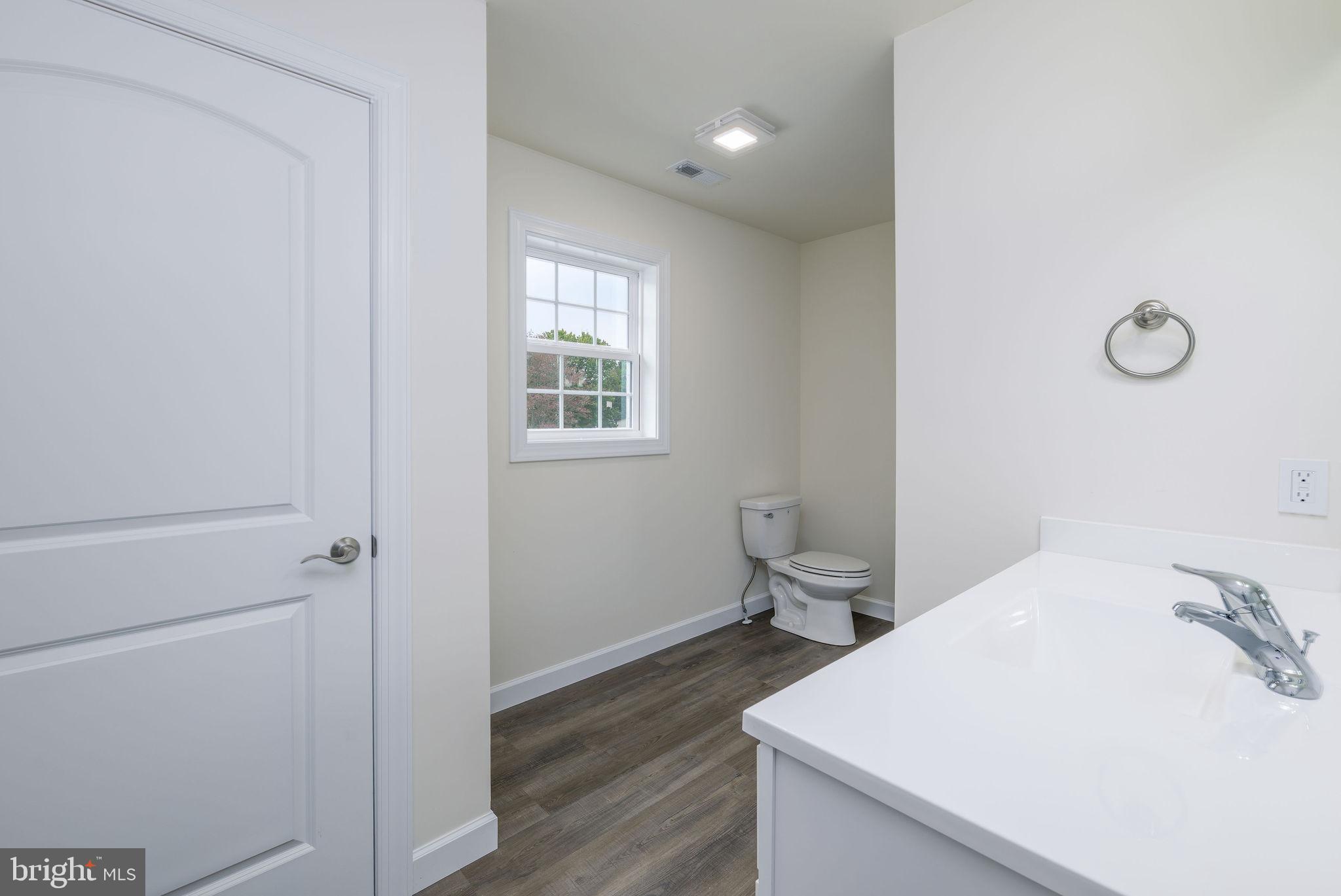 5 Valhalla Court Dover, DE 19904 - Photo 48 of 53 a bathroom with a sink toilet and window