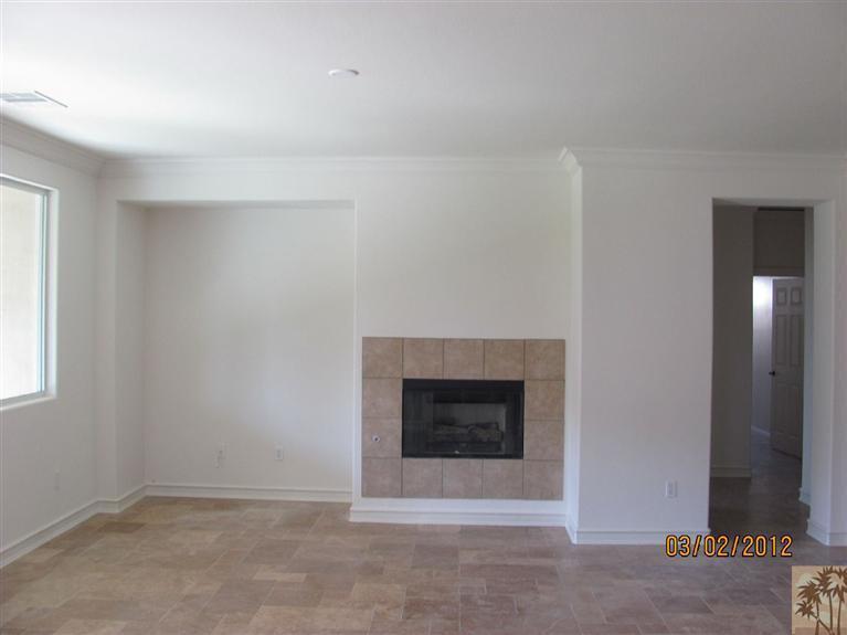 83329 Stagecoach Road Indio, CA 92203 - Photo 3 of 10 an empty room with fireplace