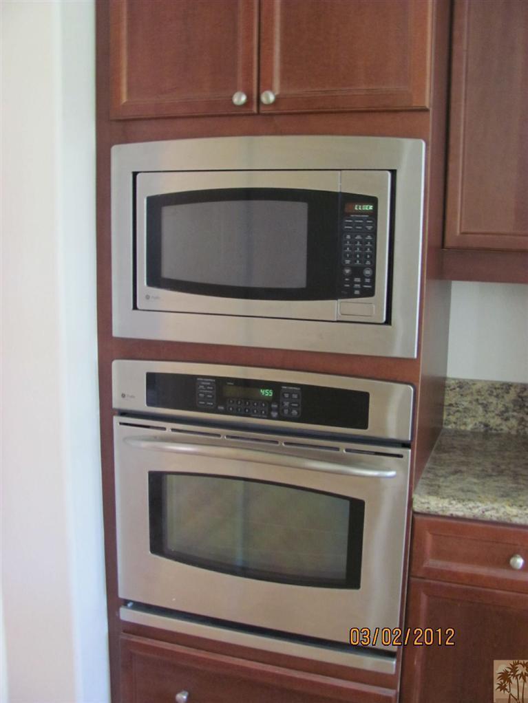 83329 Stagecoach Road Indio, CA 92203 - Photo 5 of 10 a stove top oven sitting inside of a kitchen