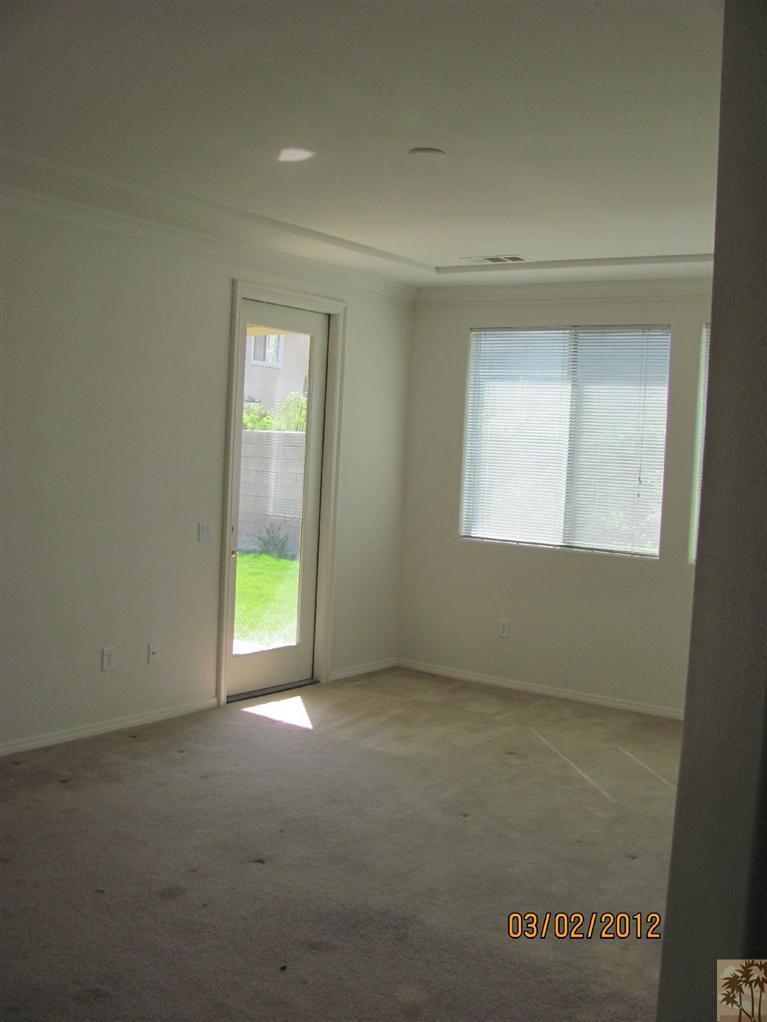 83329 Stagecoach Road Indio, CA 92203 - Photo 7 of 10 an empty room with a window
