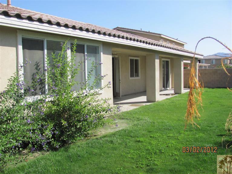 83329 Stagecoach Road Indio, CA 92203 - Photo 9 of 10 a front view of a house with garden