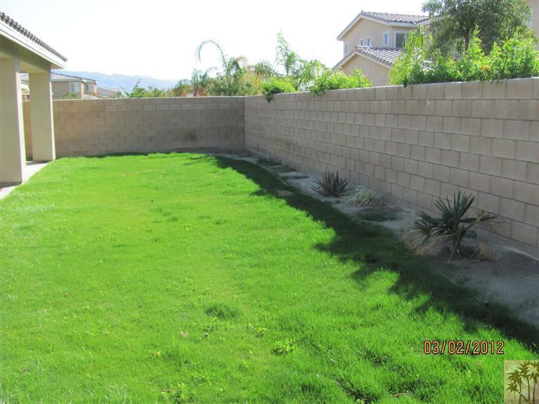 83329 Stagecoach Road Indio, CA 92203 - Photo 10 of 10 a view of a backyard with plants and lake view