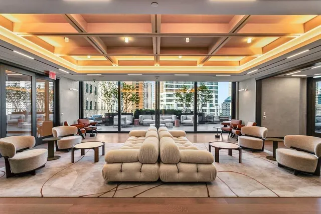 a bathroom with a granite countertop double vanity sink and a mirror