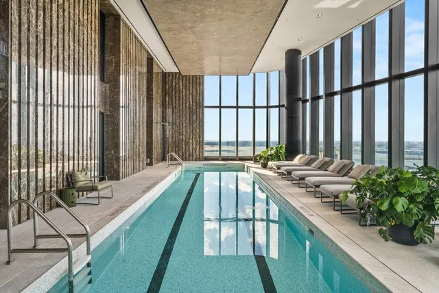 a view of swimming pool with outdoor seating