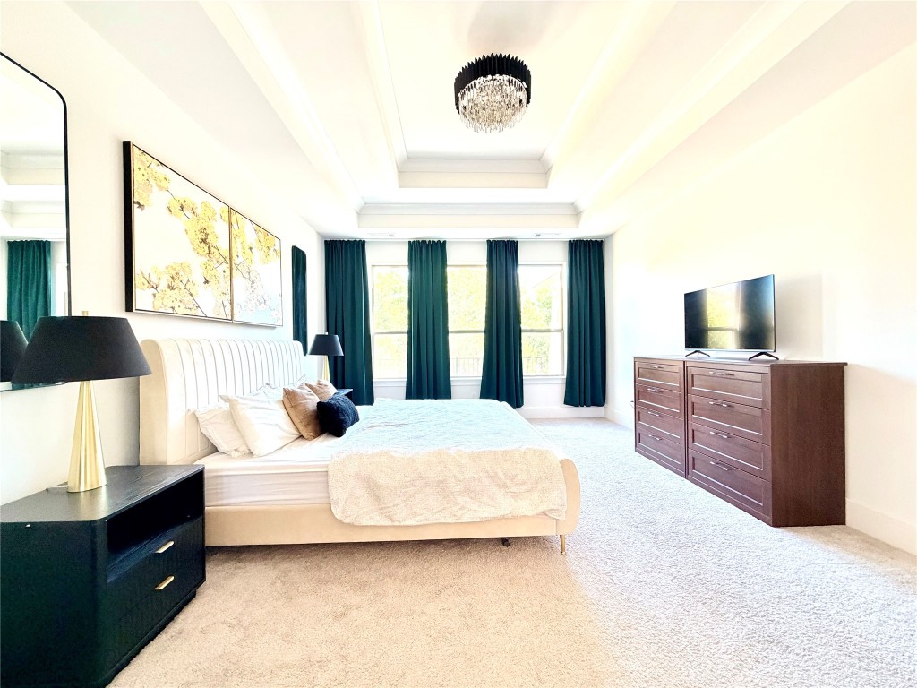 2012 Bayridge Road Georgetown, TX 78628 - Photo 16 of 32 a bedroom with a bed and dresser with mirror