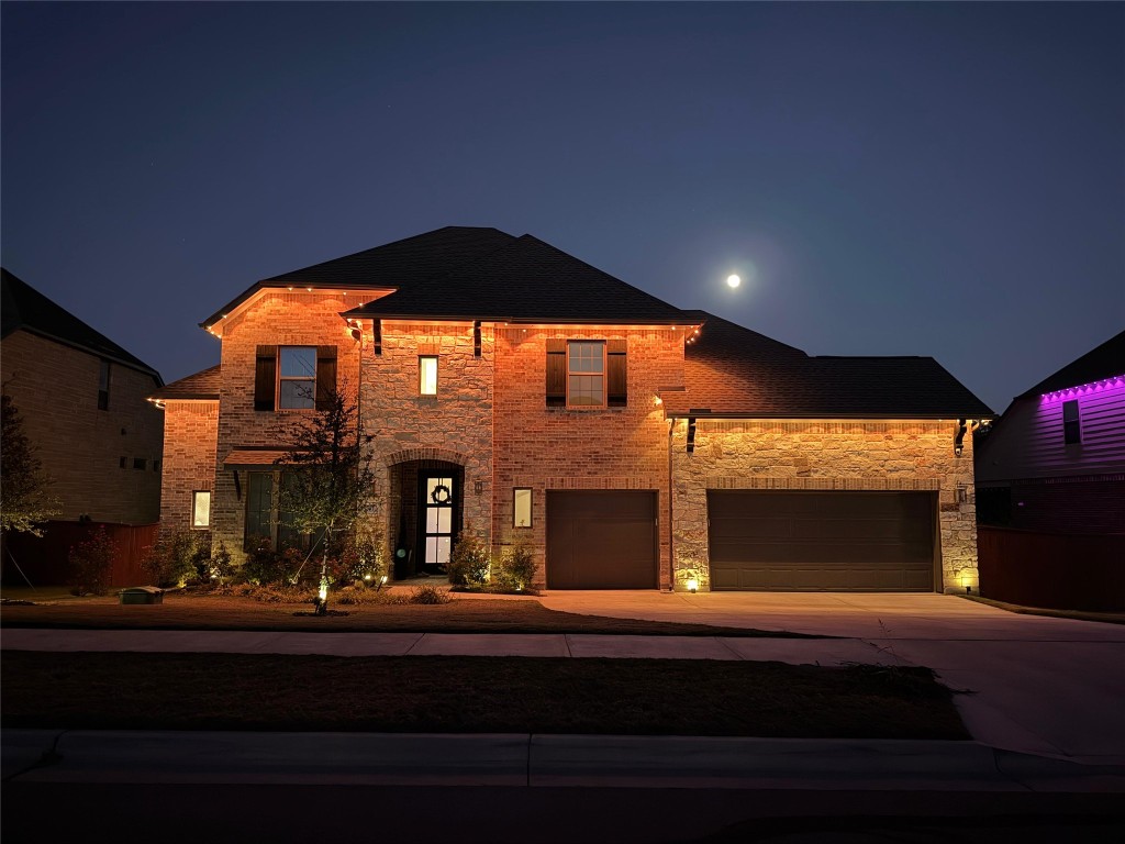 2012 Bayridge Road Georgetown, TX 78628 - Photo 2 of 32 View of front of property with driveway, roof with shingles, brick siding, and stone siding