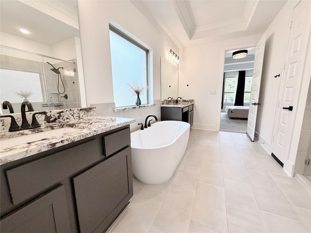 2012 Bayridge Road Georgetown, TX 78628 - Photo 21 of 32 a bathroom with a granite countertop sink and a mirror