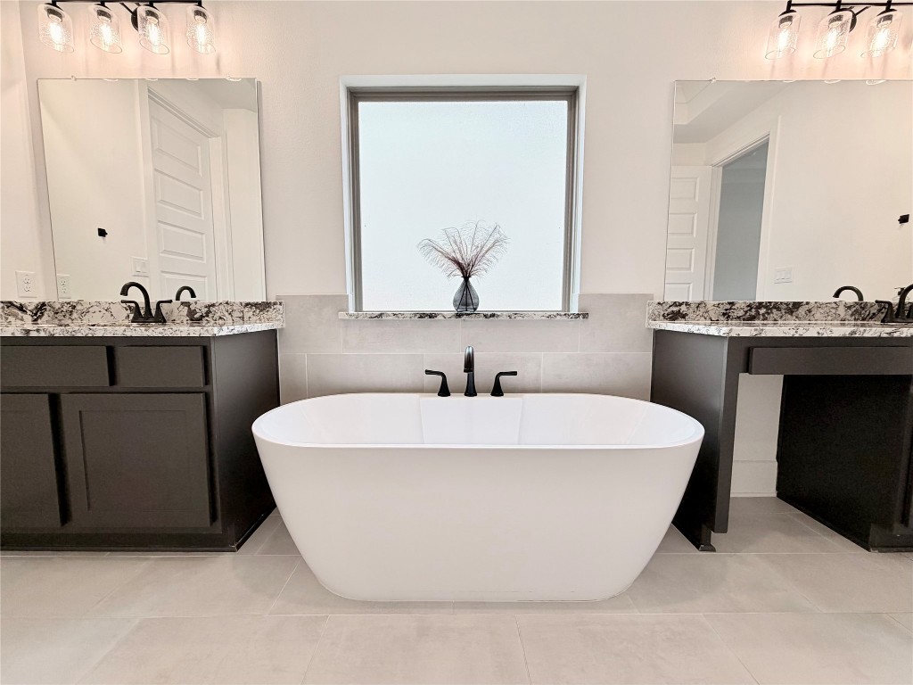 2012 Bayridge Road Georgetown, TX 78628 - Photo 22 of 32 a white bath tub sitting in a bathroom