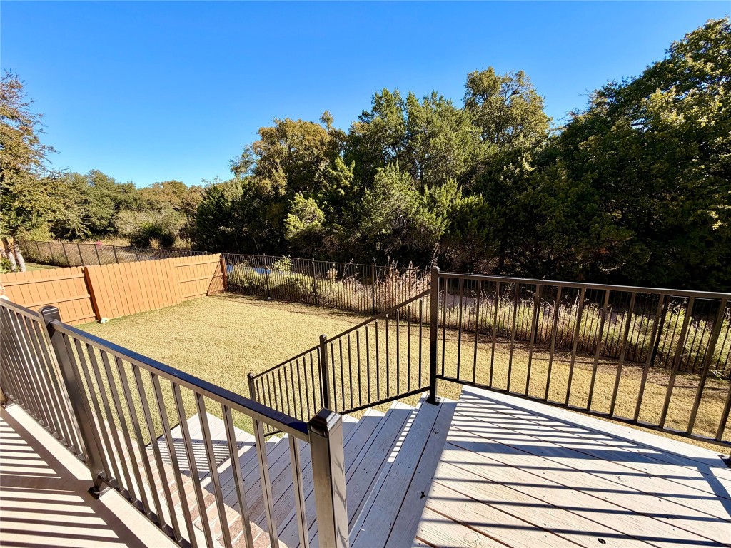 2012 Bayridge Road Georgetown, TX 78628 - Photo 31 of 32 a view of balcony with wooden floor and fence