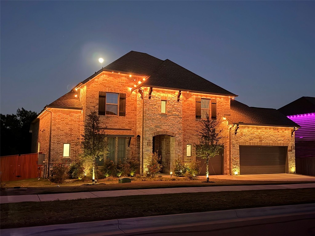 2012 Bayridge Road Georgetown, TX 78628 - Photo 32 of 32 View of front of home with roof with shingles, driveway, brick siding, and stone siding