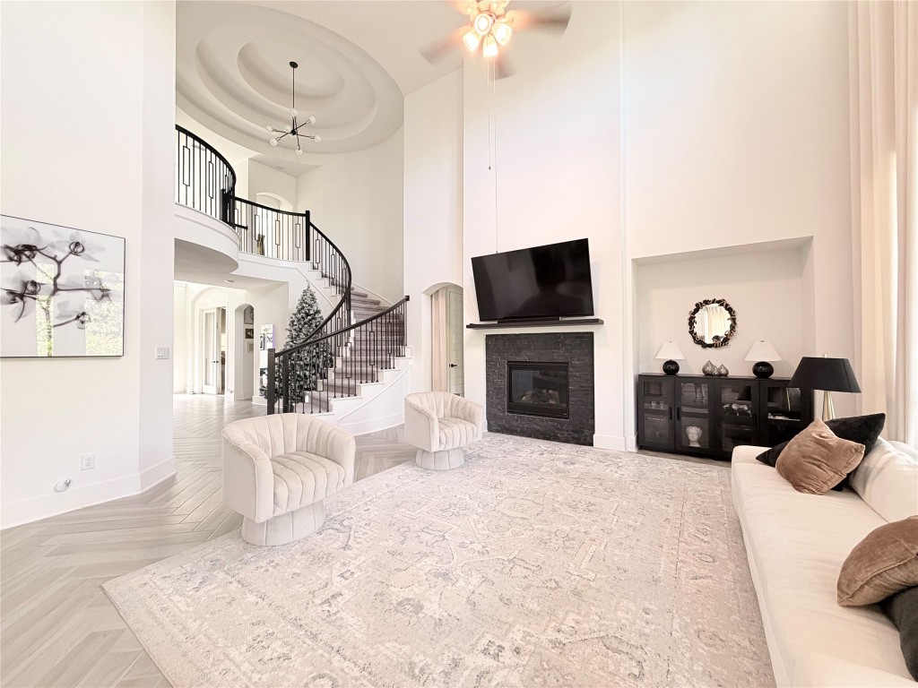 2012 Bayridge Road Georgetown, TX 78628 - Photo 4 of 32 a living room with furniture a fireplace and a flat screen tv