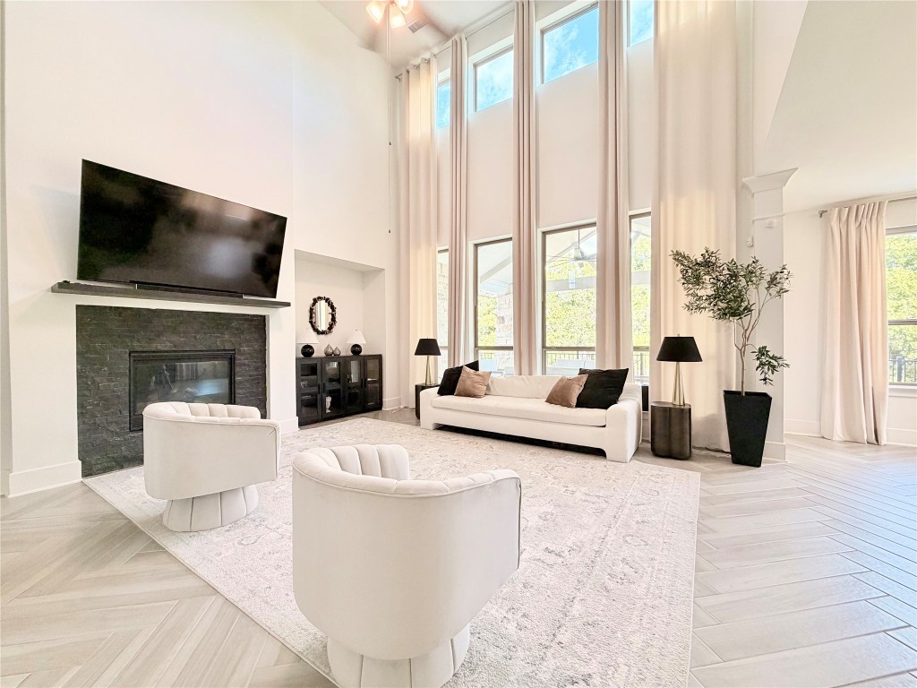 2012 Bayridge Road Georgetown, TX 78628 - Photo 5 of 32 a living room with furniture a flat screen tv and a fireplace