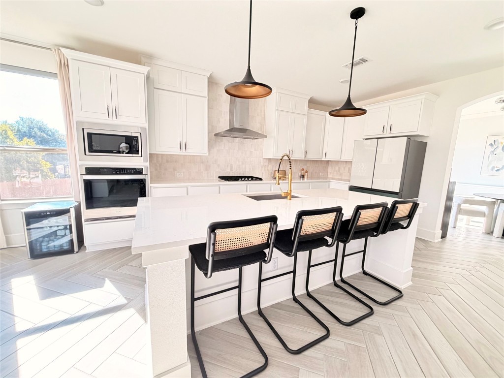 2012 Bayridge Road Georgetown, TX 78628 - Photo 9 of 32 a view of kitchen with cabinets and wooden floor
