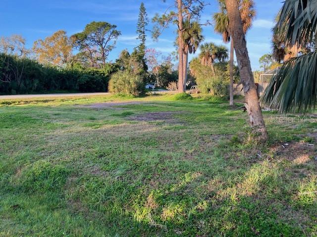 Oxalis Road Venice, FL 34293 - Photo 2 of 3 a view of a field with a tree