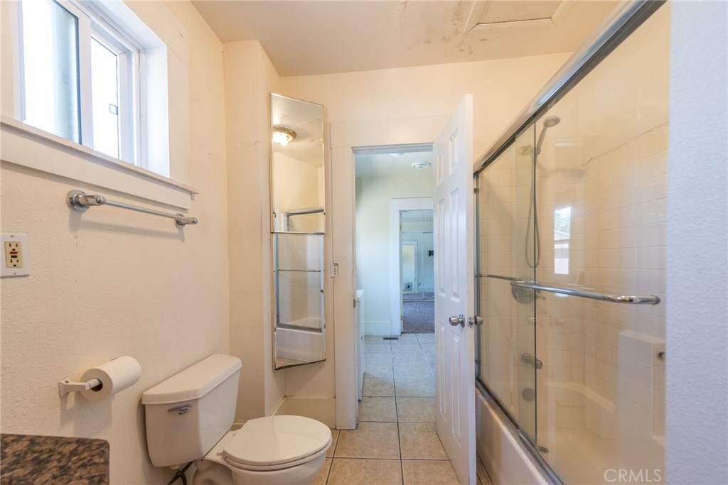 2626 5th Street Riverside, CA 92507 - Photo 13 of 31 a bathroom with a toilet and a shower