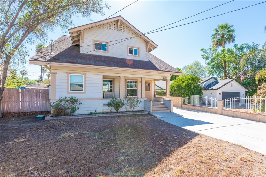2626 5th Street Riverside, CA 92507 - Photo 2 of 31 a front view of a house with a yard and potted plants
