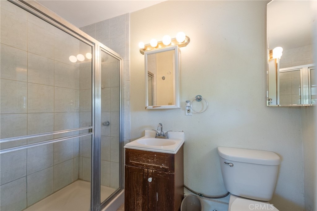2626 5th Street Riverside, CA 92507 - Photo 24 of 31 a bathroom with a sink a toilet and shower