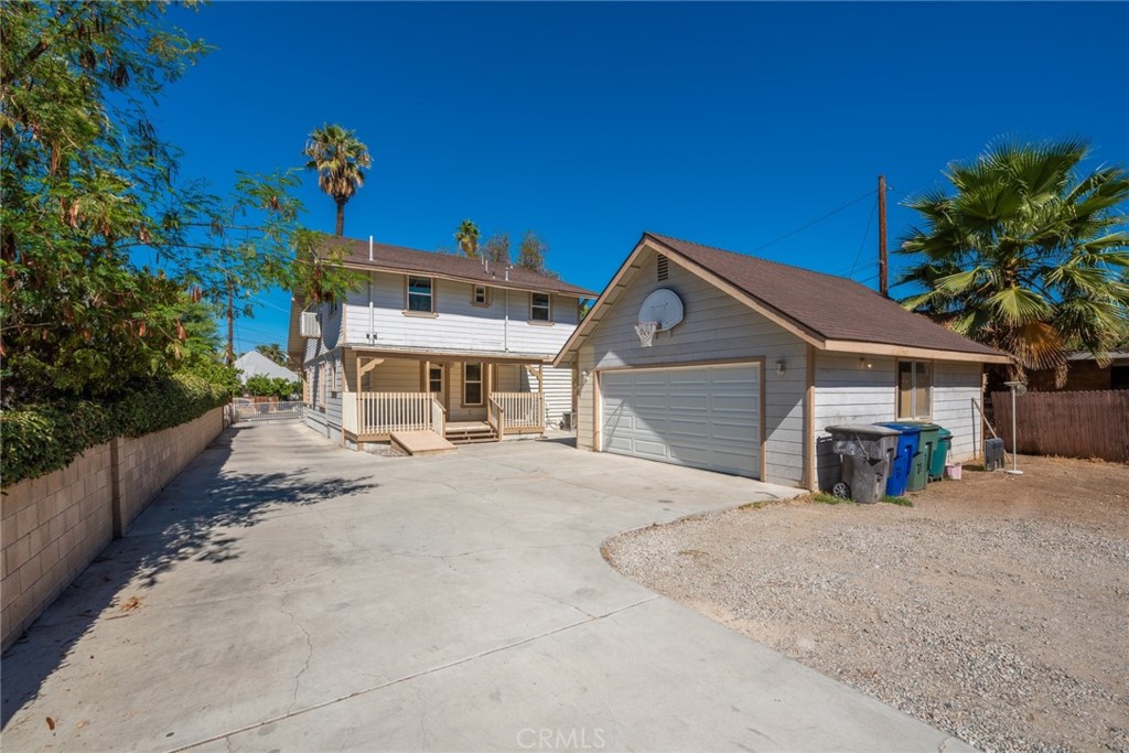 2626 5th Street Riverside, CA 92507 - Photo 28 of 31 a front view of a house with a yard and garage