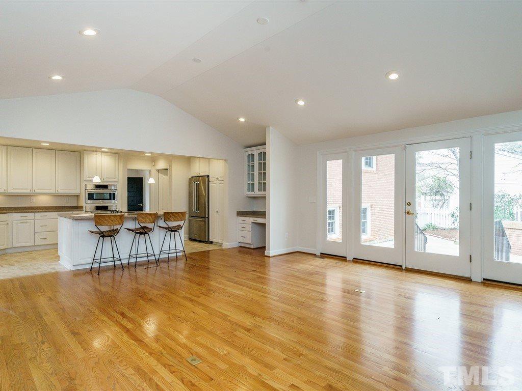 2456 Oxford Road Raleigh, NC 27608 - Photo 12 of 30 a view of a living room kitchen with furniture and wooden floor