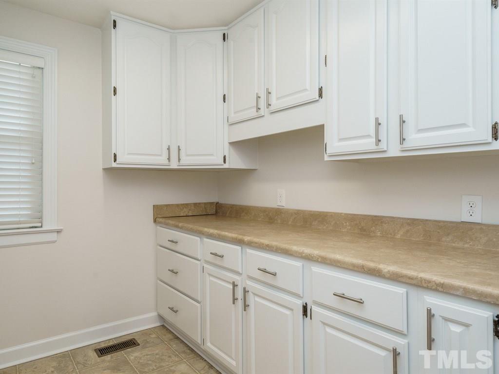 2456 Oxford Road Raleigh, NC 27608 - Photo 13 of 30 a view of cabinets and window