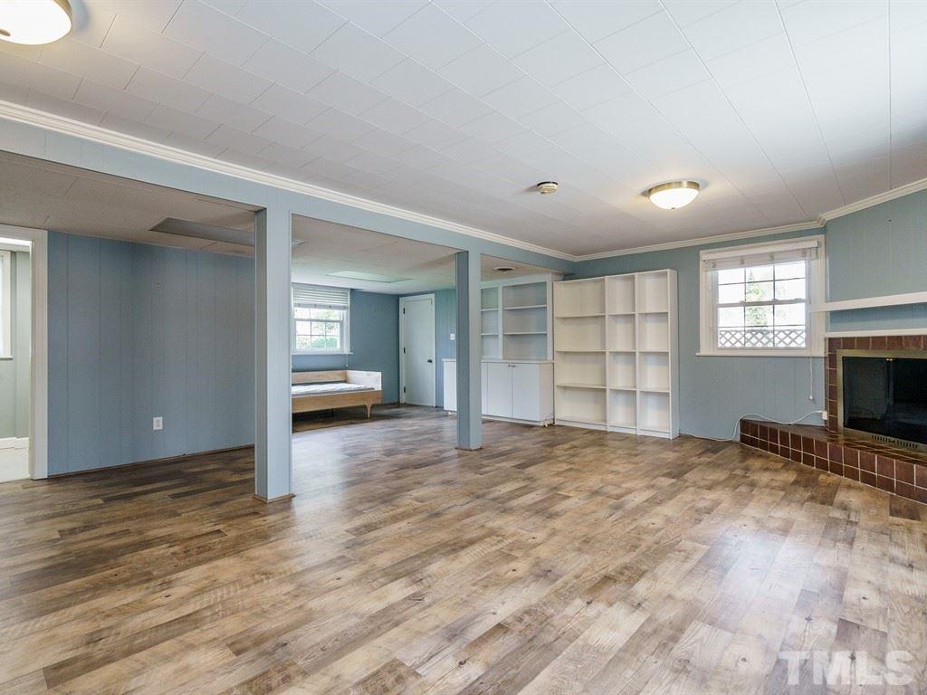 2456 Oxford Road Raleigh, NC 27608 - Photo 21 of 30 a view of empty room with a window and fireplace