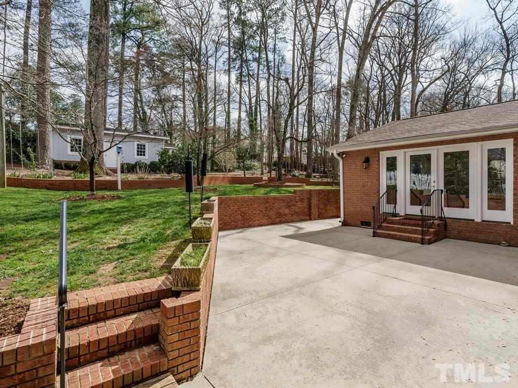 2456 Oxford Road Raleigh, NC 27608 - Photo 23 of 30 a view of a house with backyard and porch