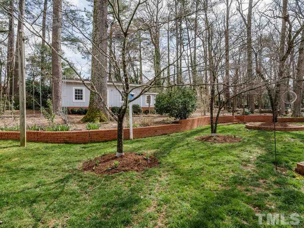 2456 Oxford Road Raleigh, NC 27608 - Photo 24 of 30 a view of a tree in front of a house